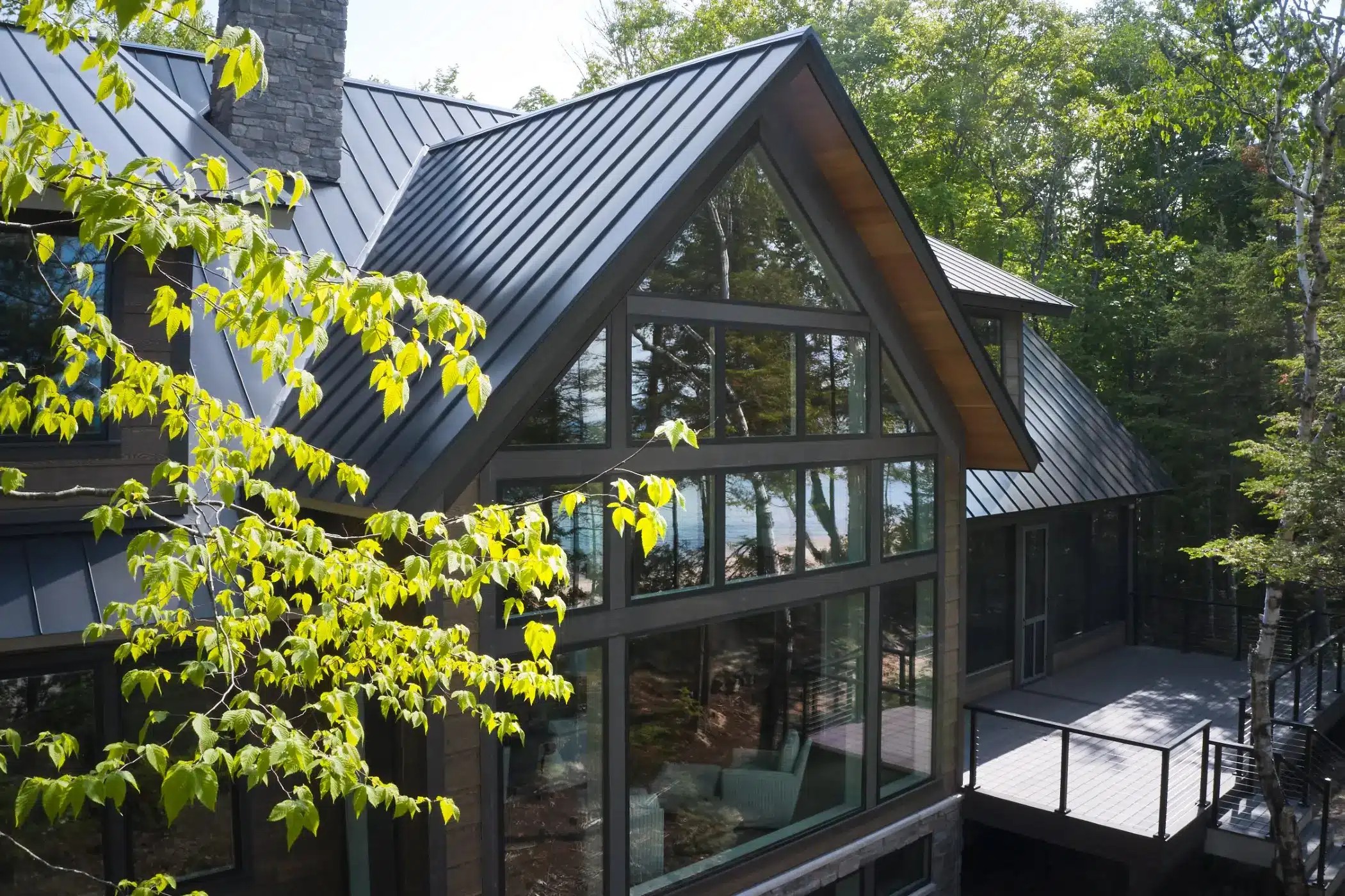 Black standing seam metal roofing on a Northern Michigan home